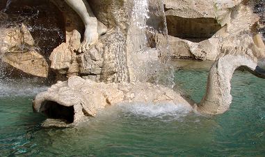 As a duckling in a swamp,
Here a Dolphin wallows in a similar way,
And another fish too, and each of them swallows
The water, already shed into the great basin